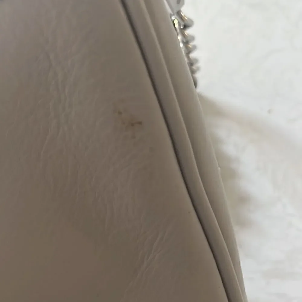 Rebecca Minkoff light gray moto leather bag with silver chain straps, crossbody